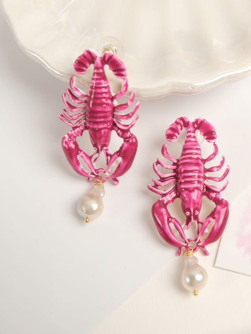 Handmade pink enamel lobster earrings with hanging white baroque pearls by TEARA.