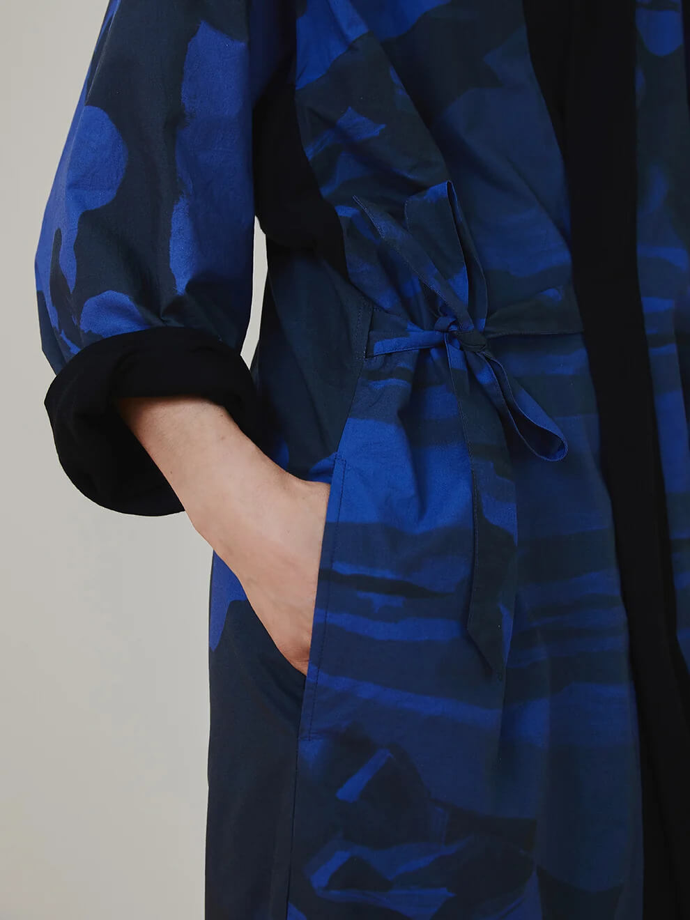 Front view of the limited capsule Jacket 001 hanging to show construction and woven seam details