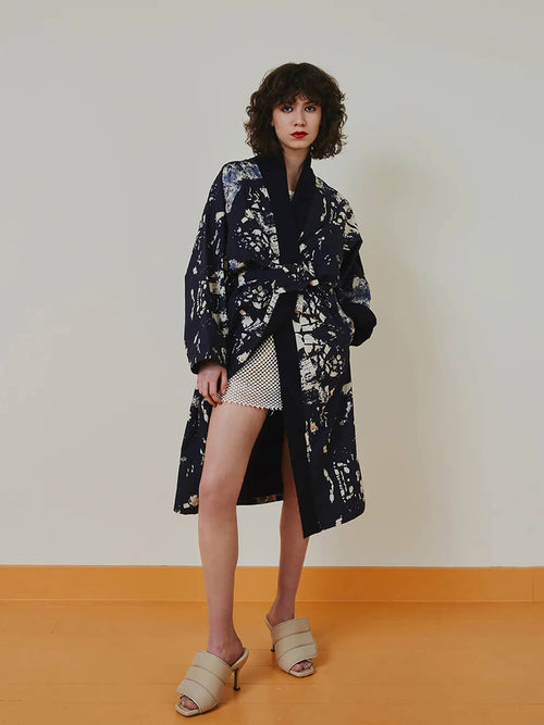 Front view of the limited capsule Jacket 006 hanging showing construction and woven details