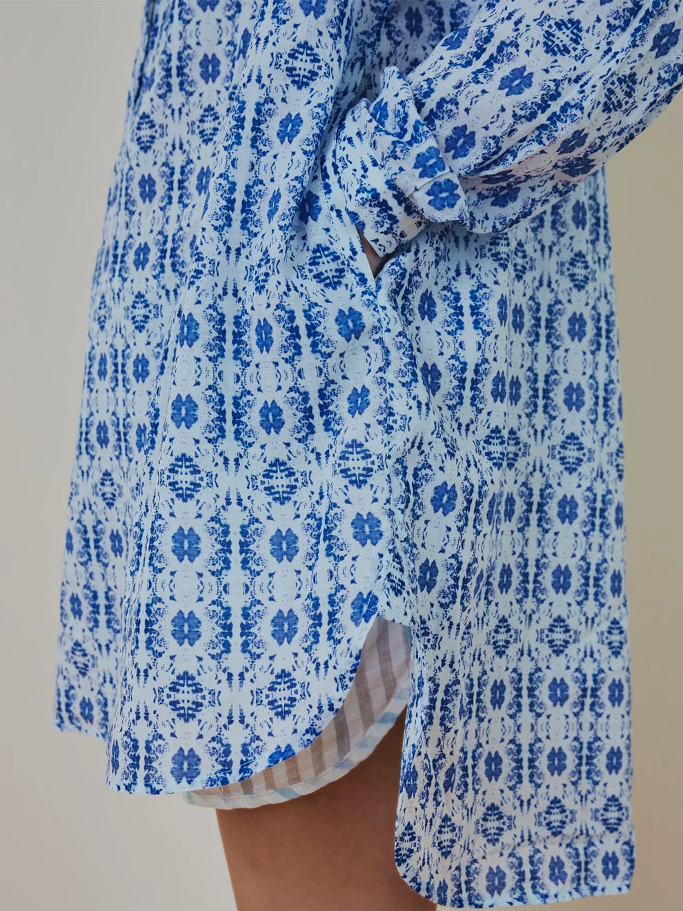 Detailed close up shot of the fine art painting print and woven trim on Shirt 007